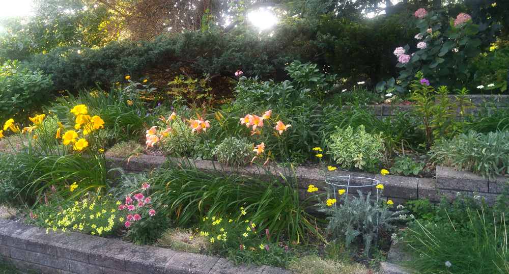 tiered garden with lilies and other flowers